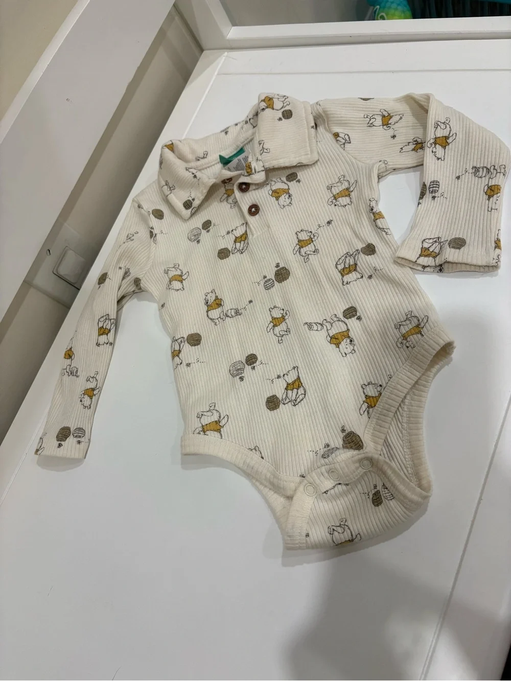 Disney Cream Ribbed Long-Sleeve One-Piece with Yellow & Brown Print